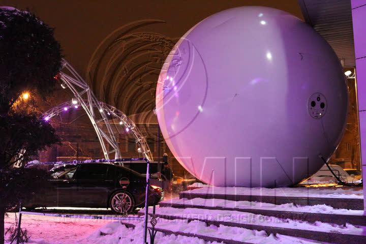 The white back half of the sphere at night