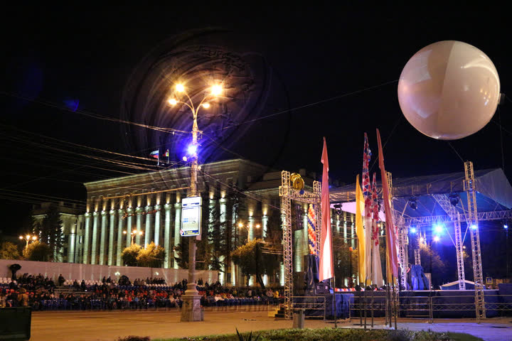 City celebration at night, above the stage